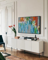 Rainbow of Stripes Crop by Danhui Nai. shown as a framed stretched canvas in a living room above a console. Available as a archival giclee rolled canvas, fine art paper, or poster print. SKU 30240i.