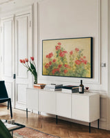 Red Geraniums on White by Danhui Nai. shown as a framed stretched canvas in a living room above a console. Available as a archival giclee rolled canvas, fine art paper, or poster print. SKU 5288i.
