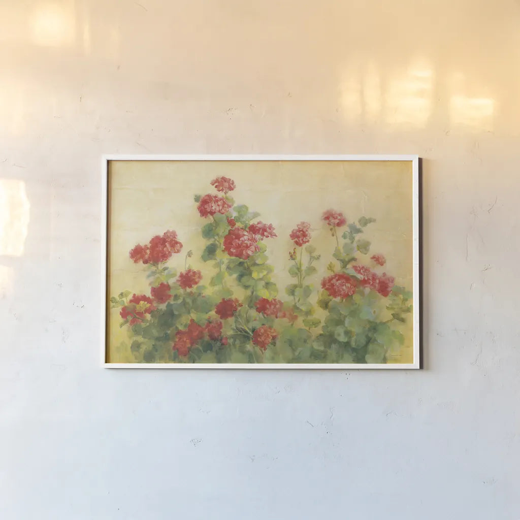 Red Geraniums on White by Danhui Nai. shown as a paper print in a white frame. Available as a archival giclee rolled canvas, fine art paper, or poster print. SKU 5288i.