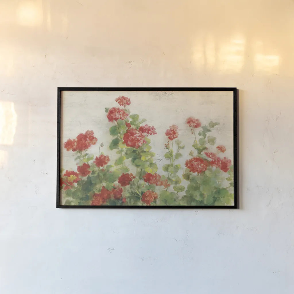Red Geraniums on White v2 by Danhui Nai. shown as a paper print in a black flame. Available as a archival giclee rolled canvas, fine art paper, or poster print. SKU 44813i.