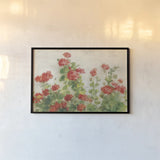 Red Geraniums on White v2 by Danhui Nai. shown as a paper print in a black flame. Available as a archival giclee rolled canvas, fine art paper, or poster print. SKU 44813i.