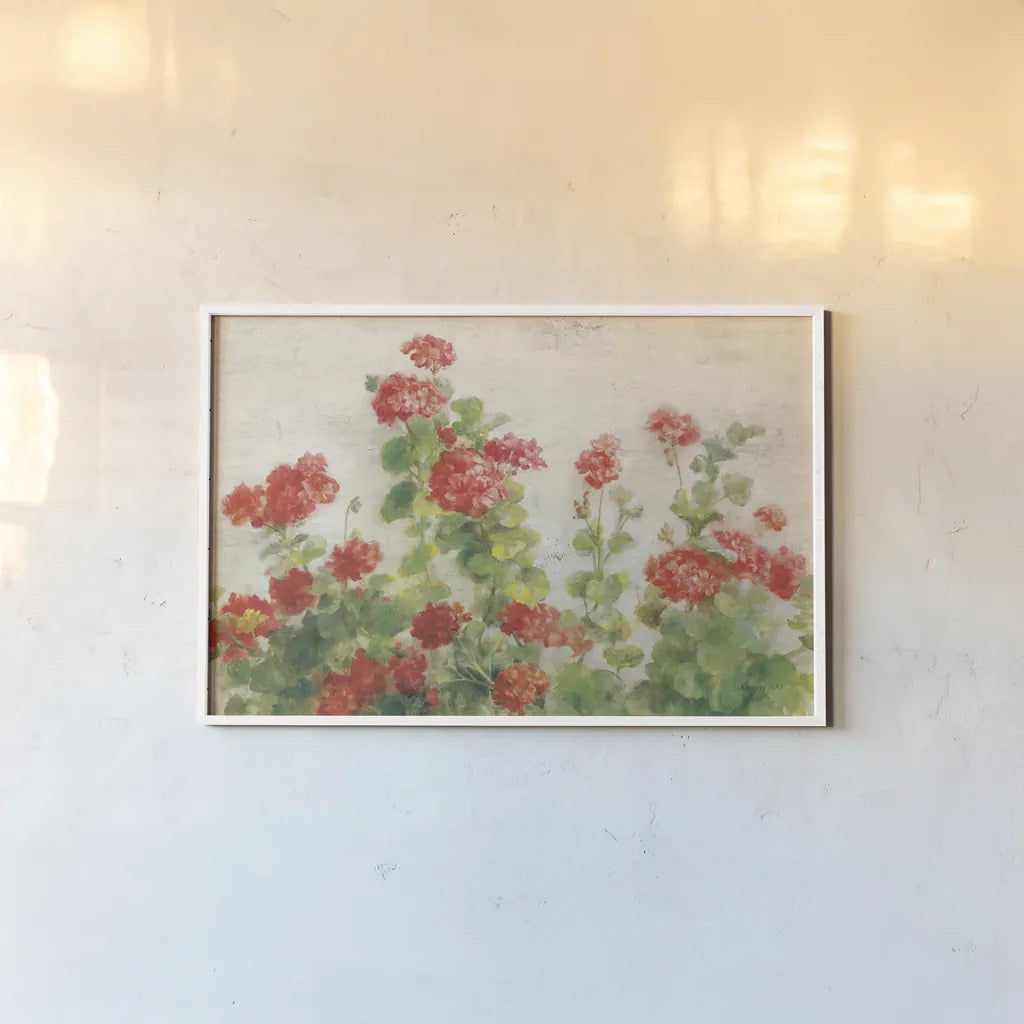 Red Geraniums on White v2 by Danhui Nai. shown as a paper print in a white frame. Available as a archival giclee rolled canvas, fine art paper, or poster print. SKU 44813i.