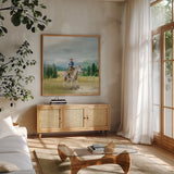 Riders of the Range I by Danhui Nai. Shown in a natural wood frame in a cozy modern living room. Available as an archival giclee rolled canvas, fine art paper, or poster print. SKU 96937a.