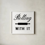Rolling With It by Danhui Nai. Shown in a crisp white glass frame for a clean and minimalist style. Available as an archival giclee rolled canvas, fine art paper, or poster print. SKU 75935a.