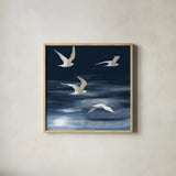 Seagulls Over the Blue Sea by Danhui Nai. Shown in a natural wood glass frame for a timeless modern aesthetic. Available as an archival giclee rolled canvas, fine art paper, or poster print. SKU 102555a.
