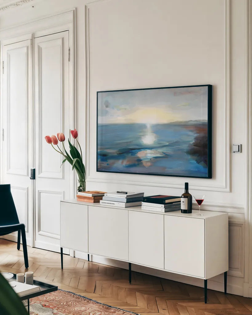 Seaside Sunrise by Danhui Nai. shown as a framed stretched canvas in a living room above a console. Available as a archival giclee rolled canvas, fine art paper, or poster print. SKU 90195i.