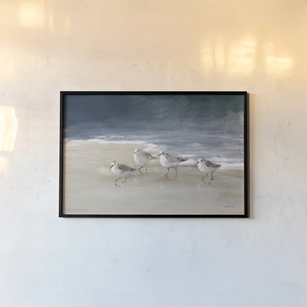 Shorebirds on Sand I Blue by Danhui Nai. shown as a paper print in a black flame. Available as a archival giclee rolled canvas, fine art paper, or poster print. SKU 88377i.