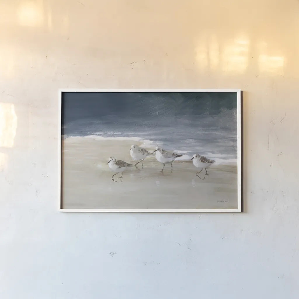 Shorebirds on Sand I Blue by Danhui Nai. shown as a paper print in a white frame. Available as a archival giclee rolled canvas, fine art paper, or poster print. SKU 88377i.