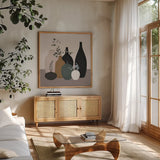 Simple Vessels II by Danhui Nai. Shown in a natural wood frame in a cozy modern living room. Available as an archival giclee rolled canvas, fine art paper, or poster print. SKU 86339a.