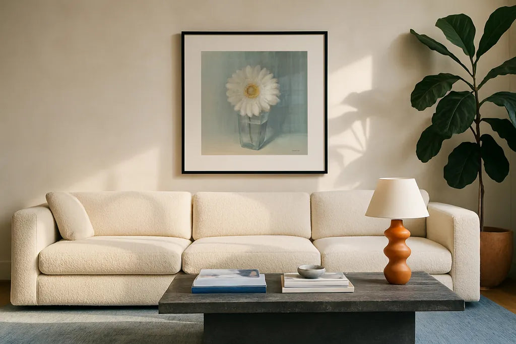 Single White Daisy by Danhui Nai. Displayed in a glass frame with matte in a clean modern living room. Available as an archival giclee rolled canvas, fine art paper, or poster print. SKU 5183a.