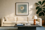 Single White Daisy by Danhui Nai. Displayed in a glass frame with matte in a clean modern living room. Available as an archival giclee rolled canvas, fine art paper, or poster print. SKU 5183a.