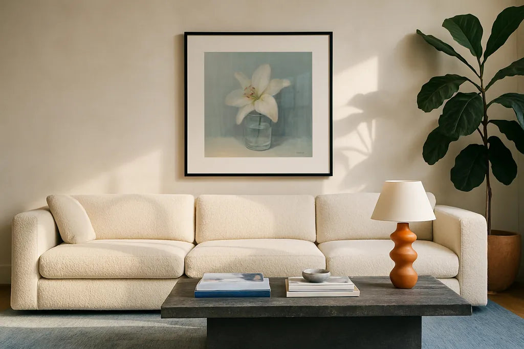 Single White Lily by Danhui Nai. Displayed in a glass frame with matte in a clean modern living room. Available as an archival giclee rolled canvas, fine art paper, or poster print. SKU 5184a.