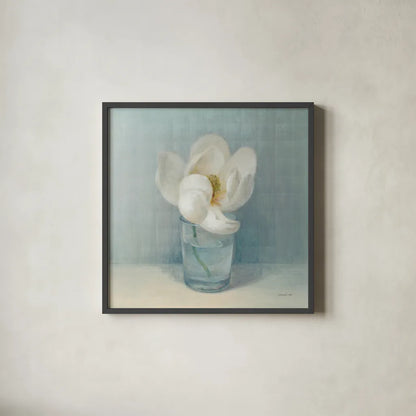 Single White Magnolia by Danhui Nai. Shown in a sleek black glass frame for a contemporary gallery look. Available as an archival giclee rolled canvas, fine art paper, or poster print. SKU 5185a.
