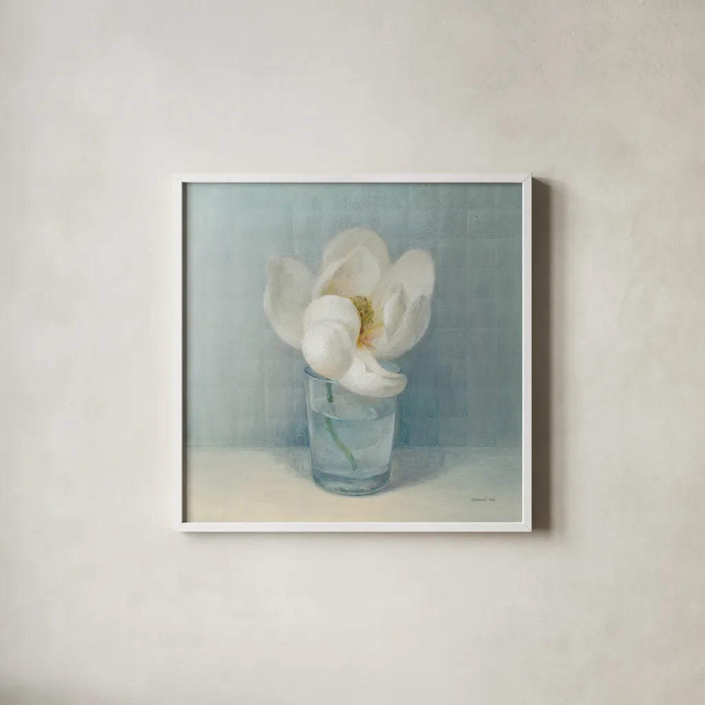 Single White Magnolia by Danhui Nai. Shown in a crisp white glass frame for a clean and minimalist style. Available as an archival giclee rolled canvas, fine art paper, or poster print. SKU 5185a.