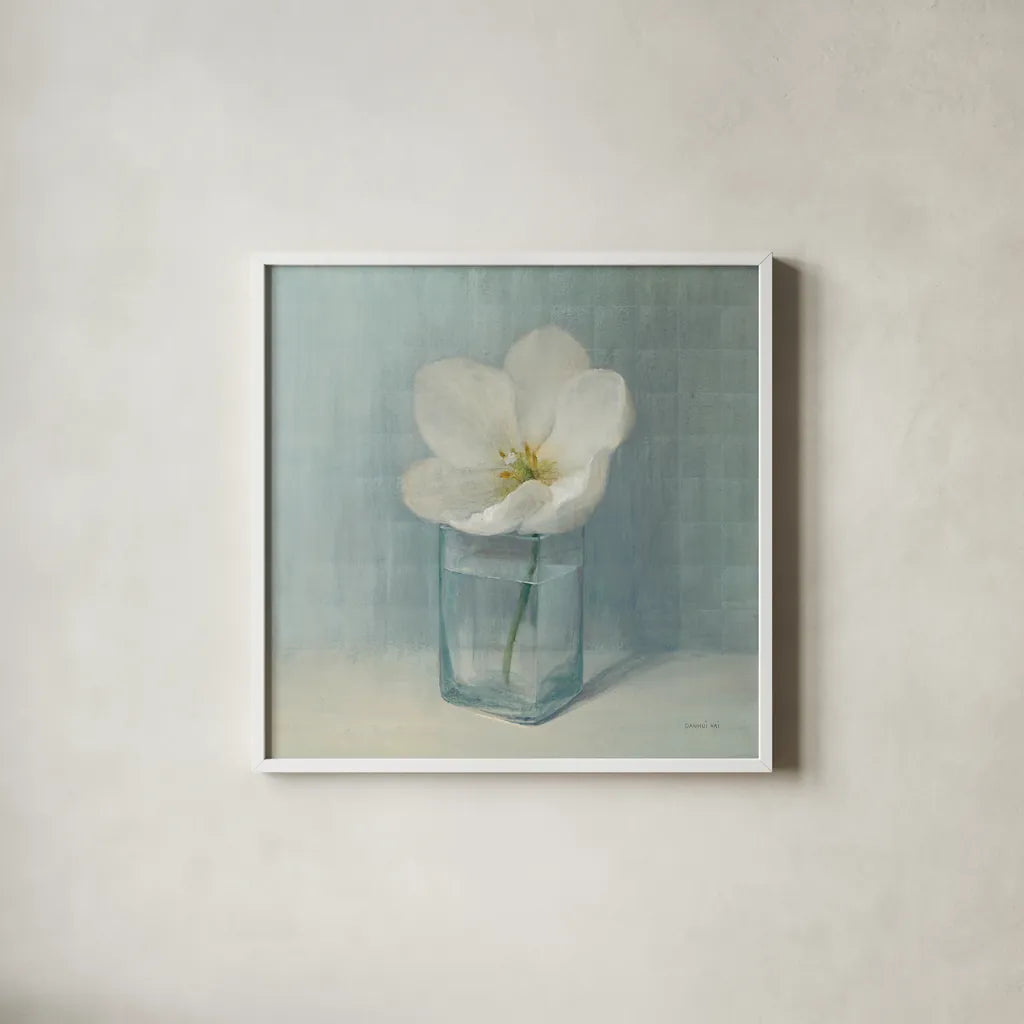 Single White Tulip by Danhui Nai. Shown in a crisp white glass frame for a clean and minimalist style. Available as an archival giclee rolled canvas, fine art paper, or poster print. SKU 5186a.