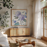 Spring Morning Blooms IV by Danhui Nai. Shown in a natural wood frame in a cozy modern living room. Available as an archival giclee rolled canvas, fine art paper, or poster print. SKU 85087a.