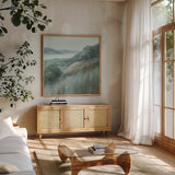 Stillness Hill by Danhui Nai. Shown in a natural wood frame in a cozy modern living room. Available as an archival giclee rolled canvas, fine art paper, or poster print. SKU 81742a.