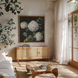 Summer Simplicity Black by Danhui Nai. Shown in a natural wood frame in a cozy modern living room. Available as an archival giclee rolled canvas, fine art paper, or poster print. SKU 96543a.