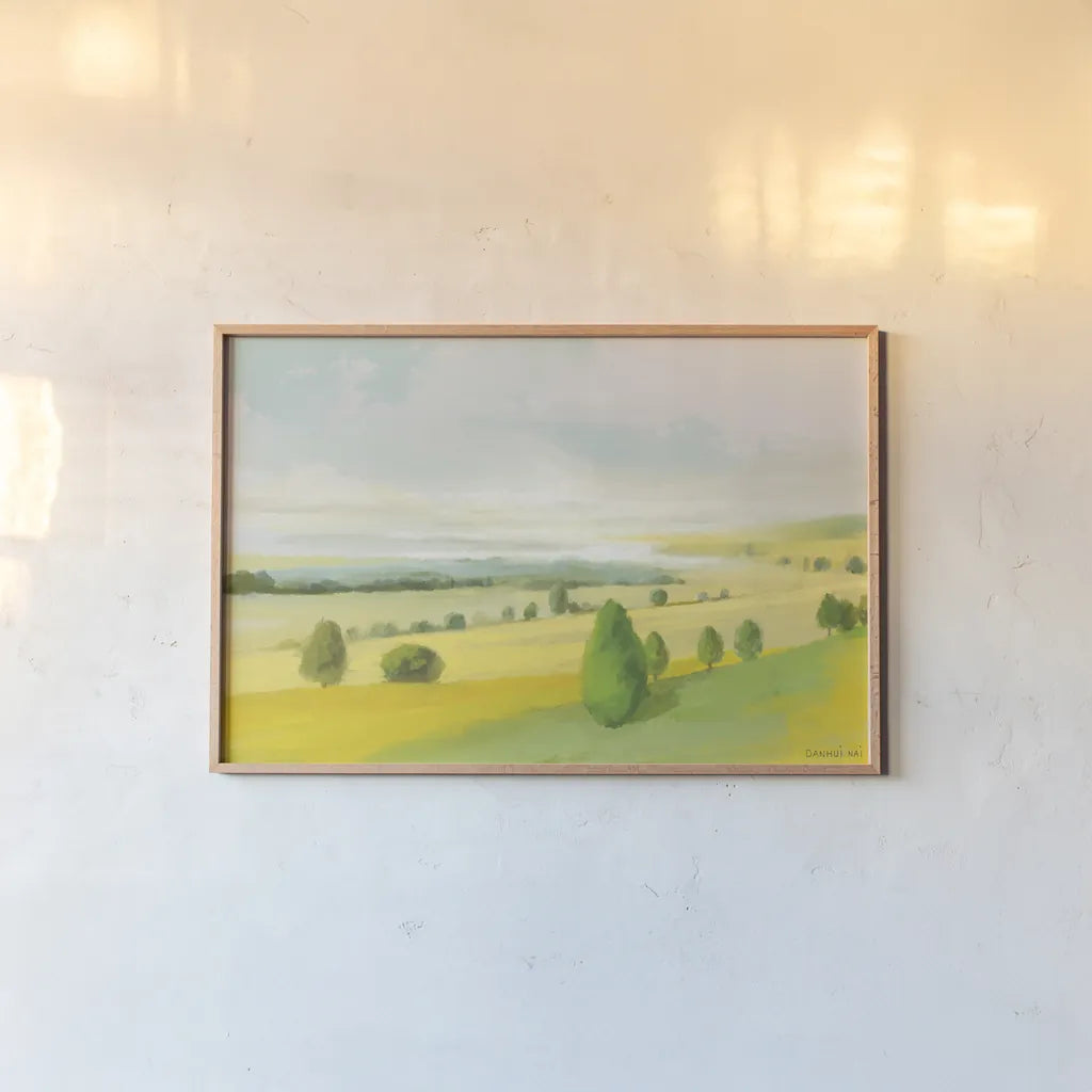 Sunlit Meadow by Danhui Nai. shown as a paper print in a natural frame. Available as a archival giclee rolled canvas, fine art paper, or poster print. SKU 100601i.