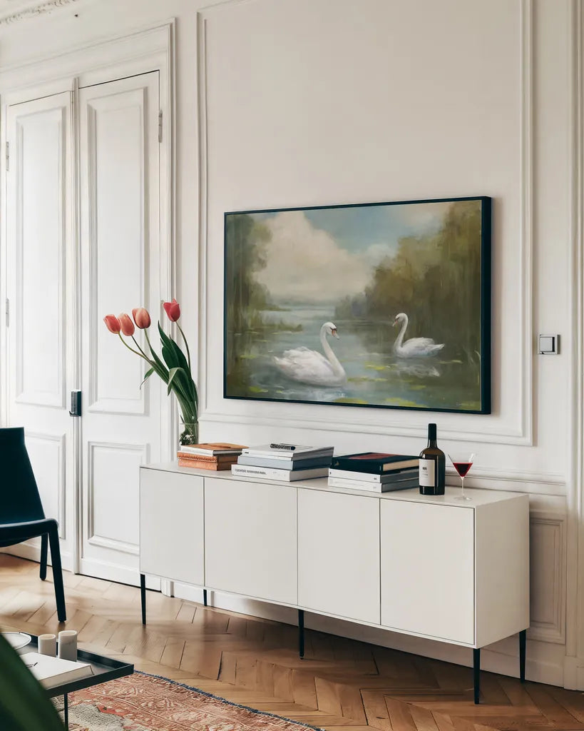 Swans by Danhui Nai. shown as a framed stretched canvas in a living room above a console. Available as a archival giclee rolled canvas, fine art paper, or poster print. SKU 100321i.