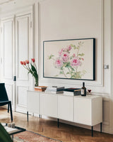 Sweet Roses on White Green by Danhui Nai. shown as a framed stretched canvas in a living room above a console. Available as a archival giclee rolled canvas, fine art paper, or poster print. SKU 35346i.