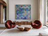 Touching Circles III by Danhui Nai. Shown as extra-large giant wall art in a modern living room. Available as an archival giclee rolled canvas, fine art paper, or poster print. SKU 44154a.