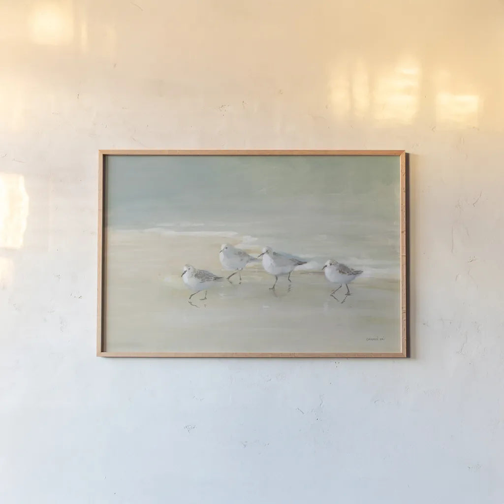 Tranquil Shorebirds on the Sand I by Danhui Nai. shown as a paper print in a natural frame. Available as a archival giclee rolled canvas, fine art paper, or poster print. SKU 85290i.