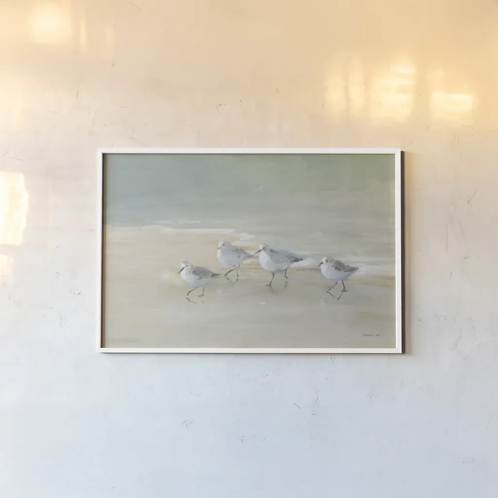 Tranquil Shorebirds on the Sand I by Danhui Nai. shown as a paper print in a white frame. Available as a archival giclee rolled canvas, fine art paper, or poster print. SKU 85290i.