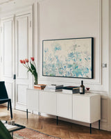 Translucent Garden Blue Crop by Danhui Nai. shown as a framed stretched canvas in a living room above a console. Available as a archival giclee rolled canvas, fine art paper, or poster print. SKU 37425i.