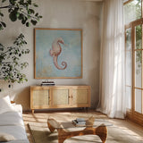Treasures from the Sea I Watercolor by Danhui Nai. Shown in a natural wood frame in a cozy modern living room. Available as an archival giclee rolled canvas, fine art paper, or poster print. SKU 26757a.