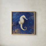 Treasures from the Sea Indigo I by Danhui Nai. Shown in a natural wood glass frame for a timeless modern aesthetic. Available as an archival giclee rolled canvas, fine art paper, or poster print. SKU 20048a.