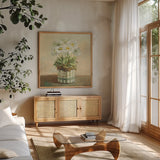 Tres Chic Daisies by Danhui Nai. Shown in a natural wood frame in a cozy modern living room. Available as an archival giclee rolled canvas, fine art paper, or poster print. SKU 10158a.