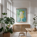 Tropical Cocktails I by Danhui Nai. shown as a print in a natural wood frame in a dining room. Available as a archival giclee rolled canvas, fine art paper, or poster print. SKU 92426h.