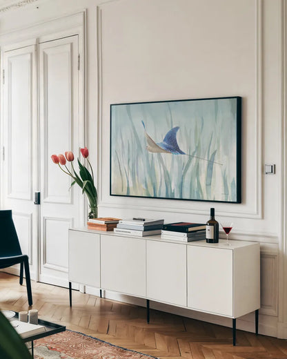 Undersea Ray by Danhui Nai. shown as a framed stretched canvas in a living room above a console. Available as a archival giclee rolled canvas, fine art paper, or poster print. SKU 71229i.