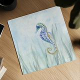 Undersea Seahorse Swimming by Danhui Nai. Shown as a detailed flat fine art print, highlighting archival giclee quality. Available as an archival giclee rolled canvas, fine art paper, or poster print. SKU 83570a.