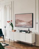 Warm Geometric Mountain by Danhui Nai. shown as a framed stretched canvas in a living room above a console. Available as a archival giclee rolled canvas, fine art paper, or poster print. SKU 72047i.