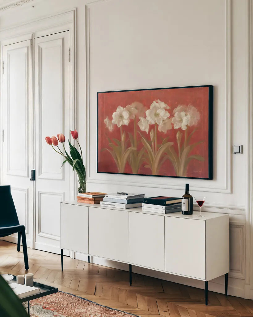 White Amaryllis on Red by Danhui Nai. shown as a framed stretched canvas in a living room above a console. Available as a archival giclee rolled canvas, fine art paper, or poster print. SKU 5244i.