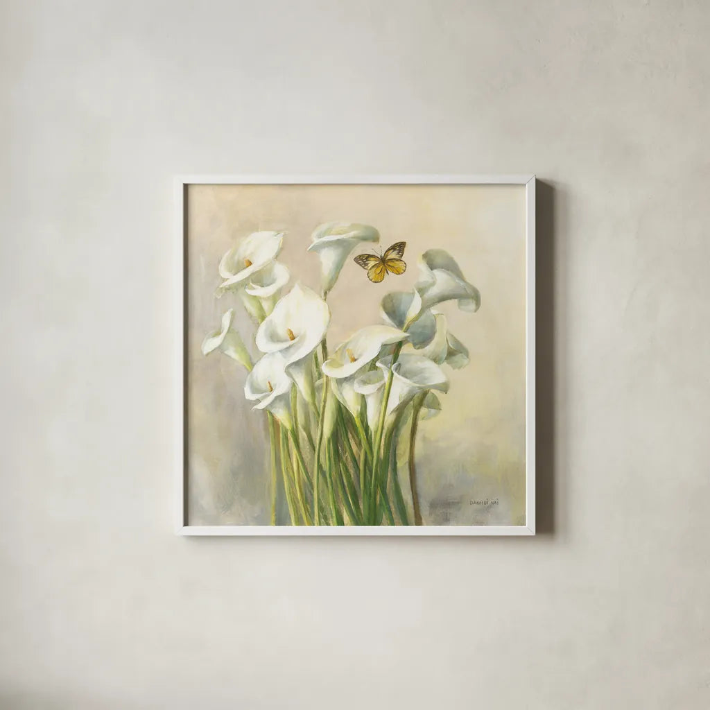 White Calla Lilies by Danhui Nai. Shown in a crisp white glass frame for a clean and minimalist style. Available as an archival giclee rolled canvas, fine art paper, or poster print. SKU 93198a.