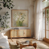 White Calla Lilies by Danhui Nai. Shown in a natural wood frame in a cozy modern living room. Available as an archival giclee rolled canvas, fine art paper, or poster print. SKU 93198a.