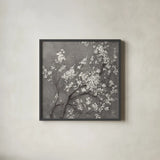 White Cherry Blossoms I on Grey Crop by Danhui Nai. Shown in a sleek black glass frame for a contemporary gallery look. Available as an archival giclee rolled canvas, fine art paper, or poster print. SKU 30776a.