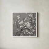 White Cherry Blossoms I on Grey Crop by Danhui Nai. Shown in a crisp white glass frame for a clean and minimalist style. Available as an archival giclee rolled canvas, fine art paper, or poster print. SKU 30776a.