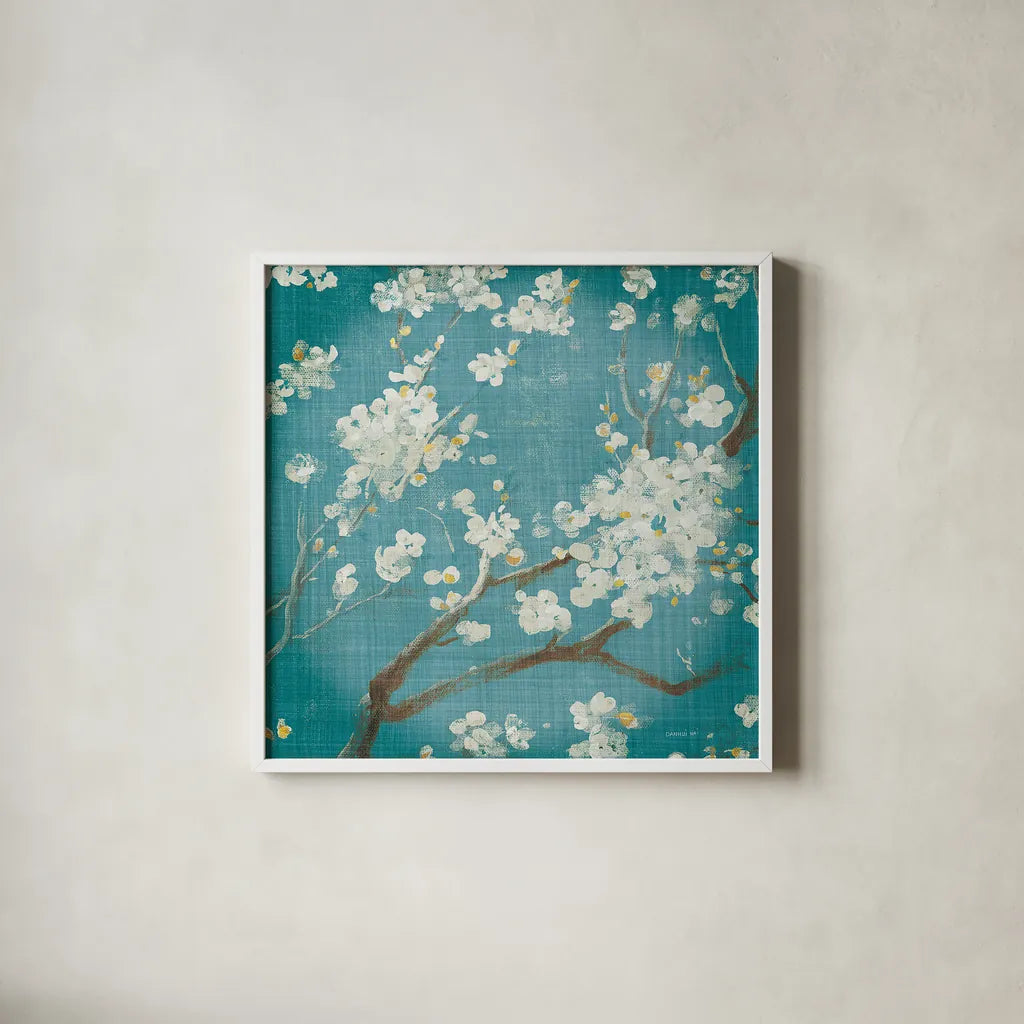 White Cherry Blossoms I on Teal Aged no Bird by Danhui Nai. Shown in a crisp white glass frame for a clean and minimalist style. Available as an archival giclee rolled canvas, fine art paper, or poster print. SKU 31293a.