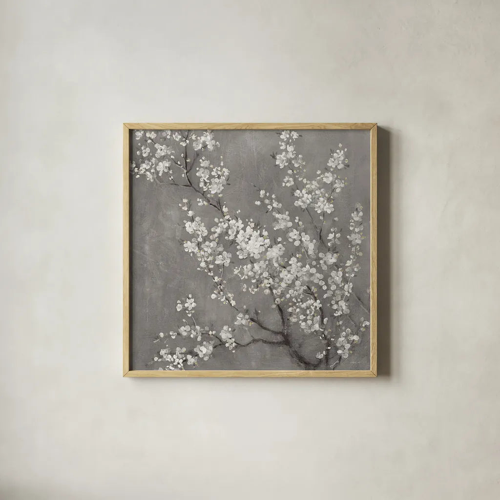 White Cherry Blossoms II on Grey Crop by Danhui Nai. Shown in a natural wood glass frame for a timeless modern aesthetic. Available as an archival giclee rolled canvas, fine art paper, or poster print. SKU 30777a.