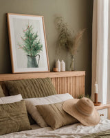 White and Bright Christmas Tree II by Danhui Nai. shown as a paper print in a natural frame. Available as a archival giclee rolled canvas, fine art paper, or poster print. SKU 65633h.