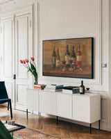 Wine Tasting by Danhui Nai. shown as a framed stretched canvas in a living room above a console. Available as a archival giclee rolled canvas, fine art paper, or poster print. SKU 6247i.