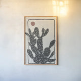 Woodcut Cactus I by Danhui Nai. shown as a paper print in a natural frame. Available as a archival giclee rolled canvas, fine art paper, or poster print. SKU 95297h.