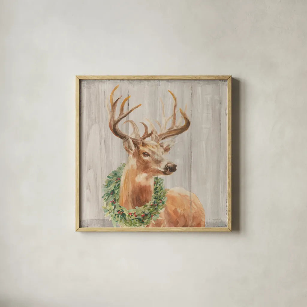 Woodland Holidays Stag with Wreath by Danhui Nai. Shown in a natural wood glass frame for a timeless modern aesthetic. Available as an archival giclee rolled canvas, fine art paper, or poster print. SKU 38880a.