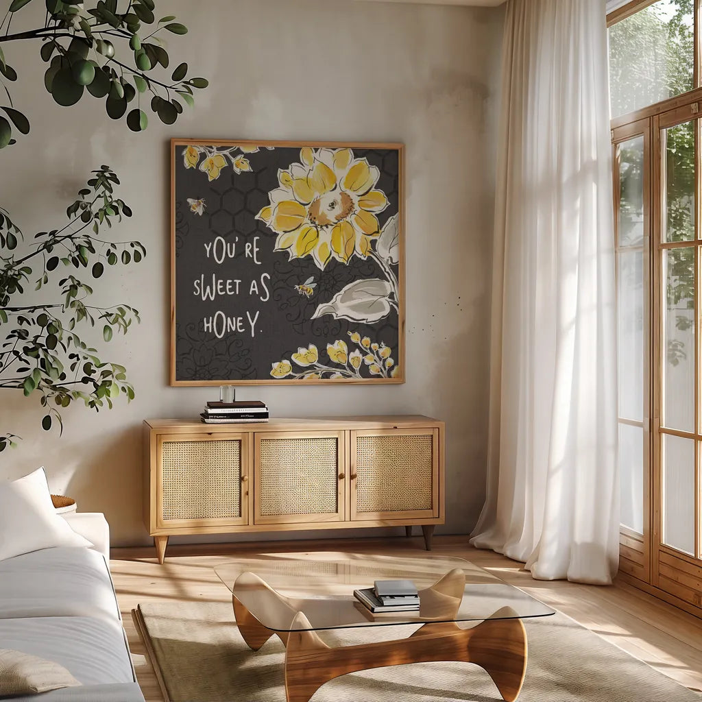Bee Happy III Black by Daphne Brissonnet. Shown in a natural wood frame in a cozy modern living room. Available as an archival giclee rolled canvas, fine art paper, or poster print. SKU 44552a.