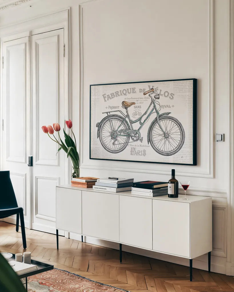 Bicycles I by Daphne Brissonnet. shown as a framed stretched canvas in a living room above a console. Available as a archival giclee rolled canvas, fine art paper, or poster print. SKU 28773i.