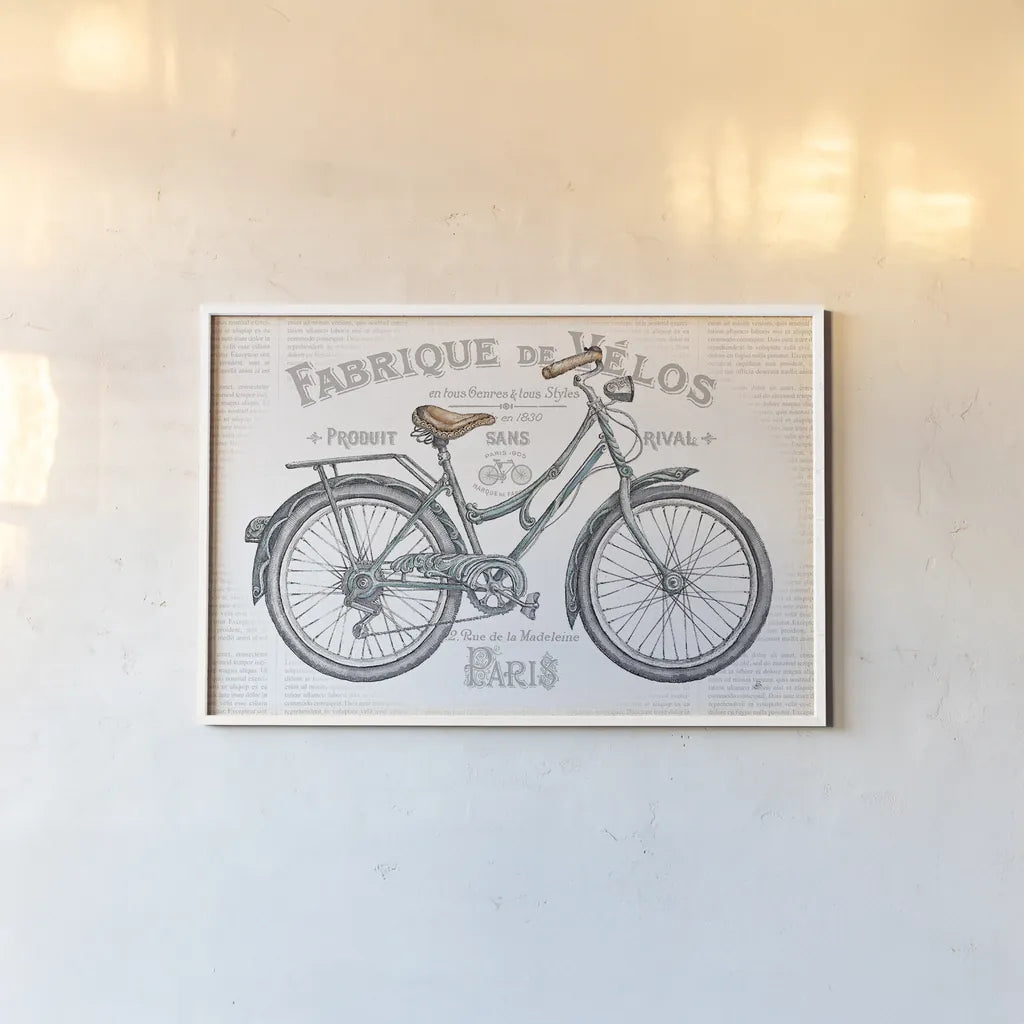 Bicycles I by Daphne Brissonnet. shown as a paper print in a white frame. Available as a archival giclee rolled canvas, fine art paper, or poster print. SKU 28773i.